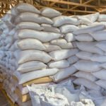 Stack of white bags at warehouse Ilustrasi stok beras/istock