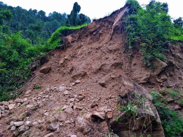 Rainy season landslide zone. Road isolated with landslide area. istockphoto 1165330614 612x612 1 -